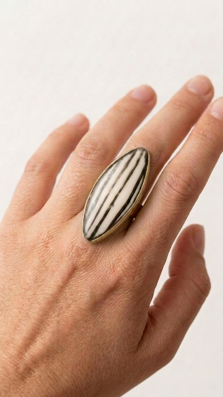 Ivory Stripe Marquise Brass Ring, on display, handmade artisan jewelry from Tanzania