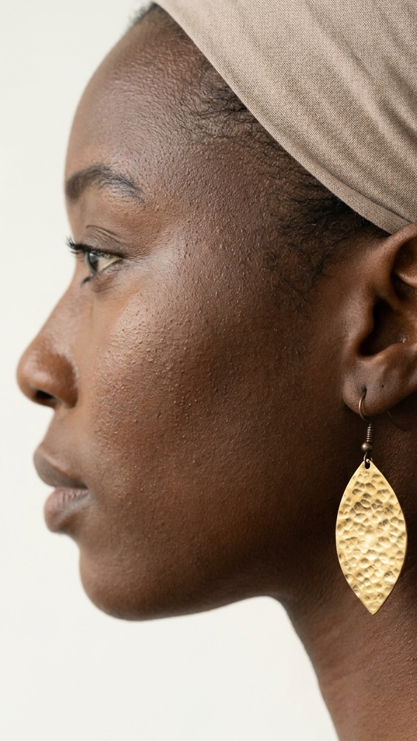 Petal Shield Brass Earrings, product view, handmade artisan jewelry from Tanzania